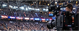 Multiple screens showing sports highlight clips in a broadcast control room